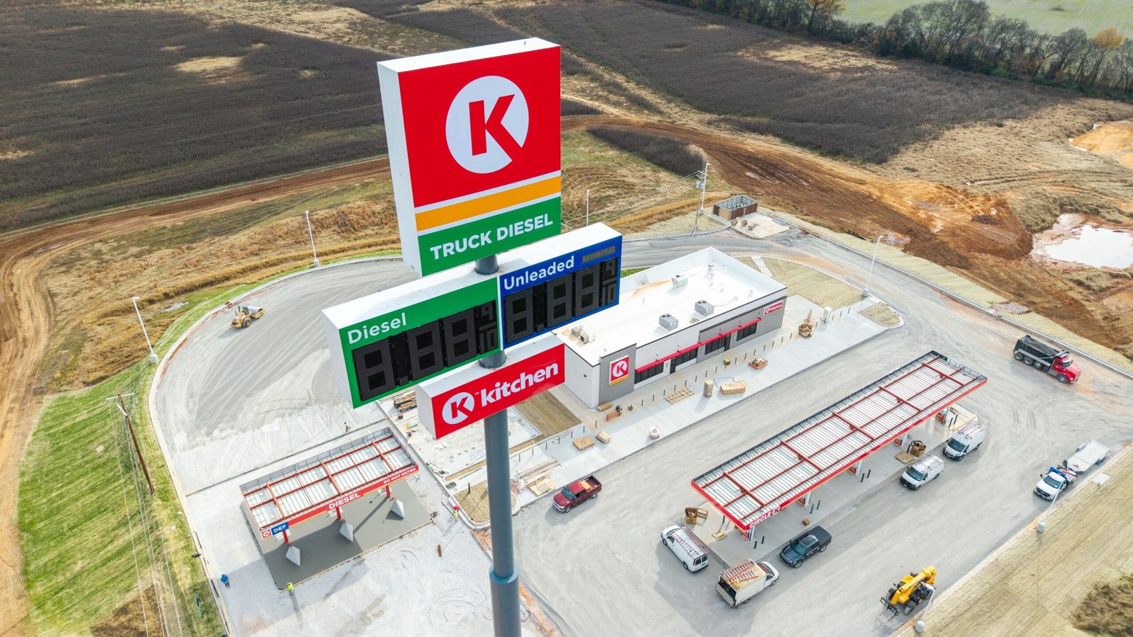 aerial photos of circle k pylon with building and pumps in the background