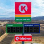 aerial photo of circle k pylon sign directly in front of it over 100 feet above ground